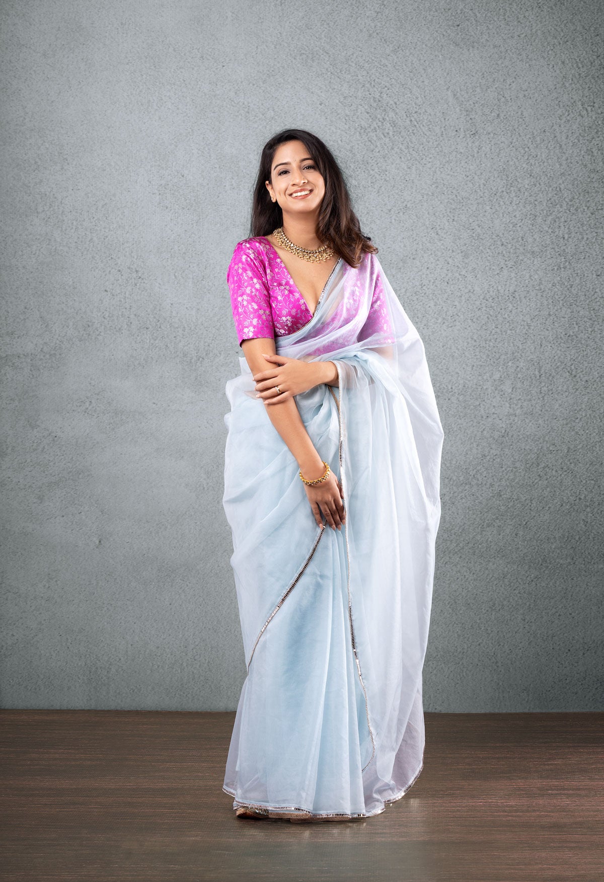 Pink Brocade Blouse with Light Blue Saree